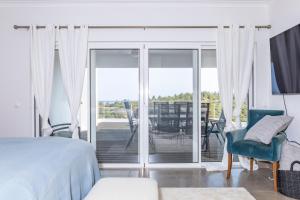 Postel nebo postele na pokoji v ubytování Villa Céu Do Sul + 36 fotografií