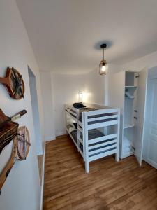 a room with a white shelf in a room at "Ô Tour's Angels" A Côté in Tours