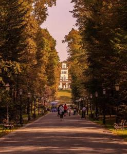 people walking down a street with a building in the background at Apartment Fala - self check-in 0-24, fast wi fi, city center in Zagreb