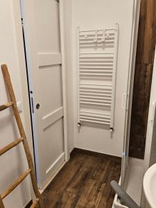 a bathroom with a white door and a sink at VILLA VILLACOLLE in Procchio +279 photos