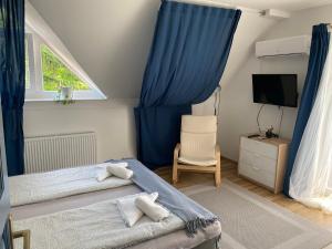 Postel nebo postele na pokoji v ubytování Babérsom apartman
