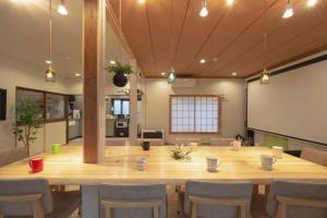 a large conference room with a large table and chairs at Private hot-spring Villa in Kusatsu in Kusatsu