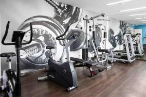 a gym with several cardio machines in a room at Conforto e Comodidade no Itaim Bibi-Apto 804 in Sao Paulo