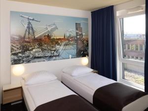 Postel nebo postele na pokoji v ubytování B&B Hotel Kiel-Wissenschaftspark