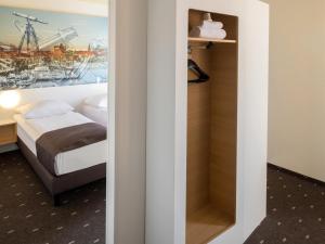 Postel nebo postele na pokoji v ubytování B&B Hotel Kiel-Wissenschaftspark