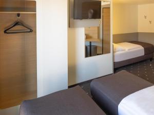 Postel nebo postele na pokoji v ubytování B&B Hotel Kiel-Wissenschaftspark