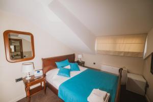 Letto o letti in una camera di Hotel Astoria