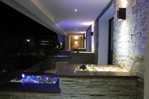 a bathtub in the middle of a building at night at Le Rocher De L'Atlas in Azrou