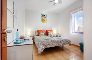 A bed or beds in a room at Villa Amistad