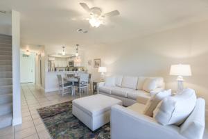 a living room with a couch and a table at LAKE PALMS 1 in Sanibel