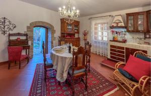 a dining room with a table and a kitchen at 2 Bedroom Beautiful Home In Corciano in Corciano
