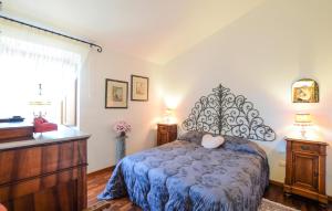 a bedroom with a bed and a dresser and a window at 2 Bedroom Beautiful Home In Corciano in Corciano