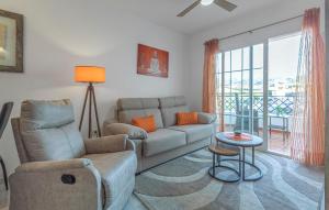 a living room with a couch and a chair at Beautiful Apartment In Torrox in Torrox