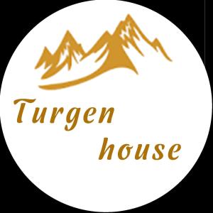 een berglogo met de woorden gemberhuis bij Turgen house in Taūtürgen