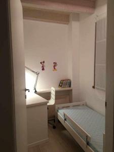 Ένα ή περισσότερα κρεβάτια σε δωμάτιο στο Appartamento Al Garibaldi