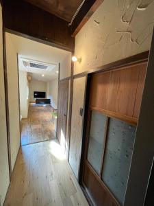 an empty room with a door and a hallway at etoile inn sumoto - Vacation STAY 49252v in Sumoto