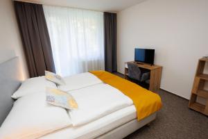 Rúm í herbergi á Hotel FIT
