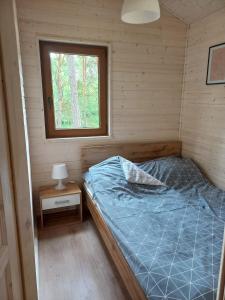 Postel nebo postele na pokoji v ubytování Wypoczywanko Domek 43, 45