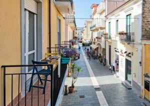 an alley in an old town with buildings at Boutique Home in Santa Maria di Castellabate