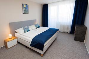 Rúm í herbergi á Hotel FIT
