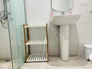 a bathroom with a sink and a shower and a toilet at Ksar Rimal par IMMO MARINA Vacances de Rêve L in M'diq +8 photos
