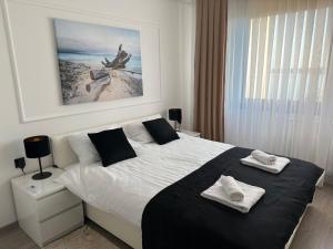 Ένα ή περισσότερα κρεβάτια σε δωμάτιο στο APARTMANI JERKOVIĆ - DUNAV 2