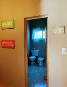 a bathroom with a toilet in a room at El campito in Ituzaingó