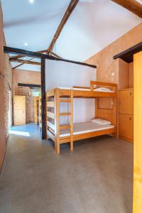 a room with bunk beds in a building at Quinta da Cortiça - Casa da Torre in Alvaiázere +23 photos