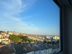 a view from a window of a city with houses at Pass the Keys Lovely 1-bedroom flat in St Leonards on Sea in Hollington