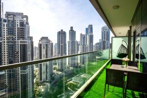 a balcony with a view of a city at Burj Khalifa Views 2BR with Infinity Pool Downtown in Dubai