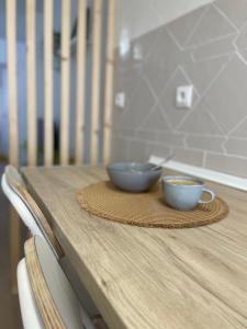 two bowls on a plate on a wooden table at Mirador Templario in Jerez de los Caballeros +39 photos