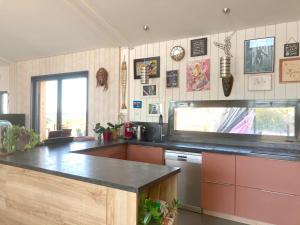a kitchen with a counter top and a window at Belle villa en Provence in Lançon-Provence