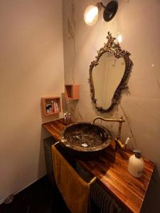 a bathroom with a sink and a mirror on a counter at Appartement t2 in Vénissieux