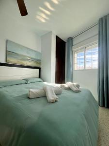 Posteľ alebo postele v izbe v ubytovaní APARTAMENTO LOS BATELES - Frente a la playa