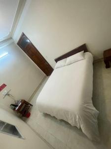 Holly's Hostel Ha Giang B&Bにあるベッド