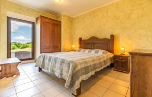 a bedroom with a bed and a large window at Villa & Ferienwohnung Rosa in Stari Pazin +8 photos