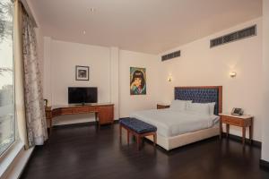Voodi või voodid majutusasutuse Riverside Hotel toas