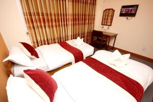 Postel nebo postele na pokoji v ubytování hotel Backpackers inn