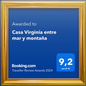 a gold picture frame with a blue background at Casa Virginia entre mar y montaña in La Paz