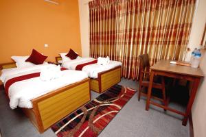 Postel nebo postele na pokoji v ubytování hotel Backpackers inn