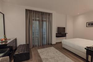 Voodi või voodid majutusasutuse Riverside Hotel toas