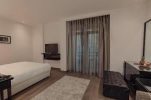 Voodi või voodid majutusasutuse Riverside Hotel toas