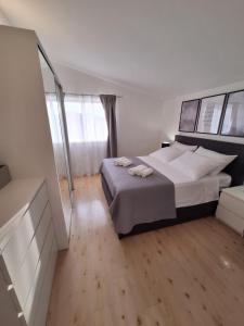 Postel nebo postele na pokoji v ubytování Sunshine Apartment Sovlje