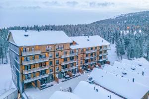an aerial view of a building in the snow at Levillas Levin Cranberry C24 in Levi