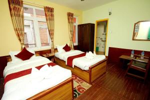 Postel nebo postele na pokoji v ubytování hotel Backpackers inn