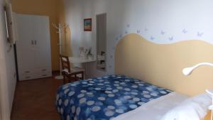 Postel nebo postele na pokoji v ubytování Villino Tronchetto Bianco