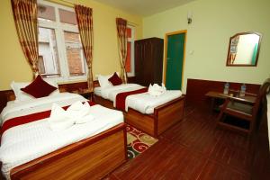 Postel nebo postele na pokoji v ubytování hotel Backpackers inn