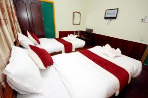 Postel nebo postele na pokoji v ubytování hotel Backpackers inn