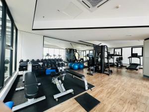 a gym with several treadmills and exercise machines at Peachy Poolview Paradise @ Paradigm Mall *10-12pax in Johor Bahru