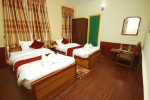 Postel nebo postele na pokoji v ubytování hotel Backpackers inn